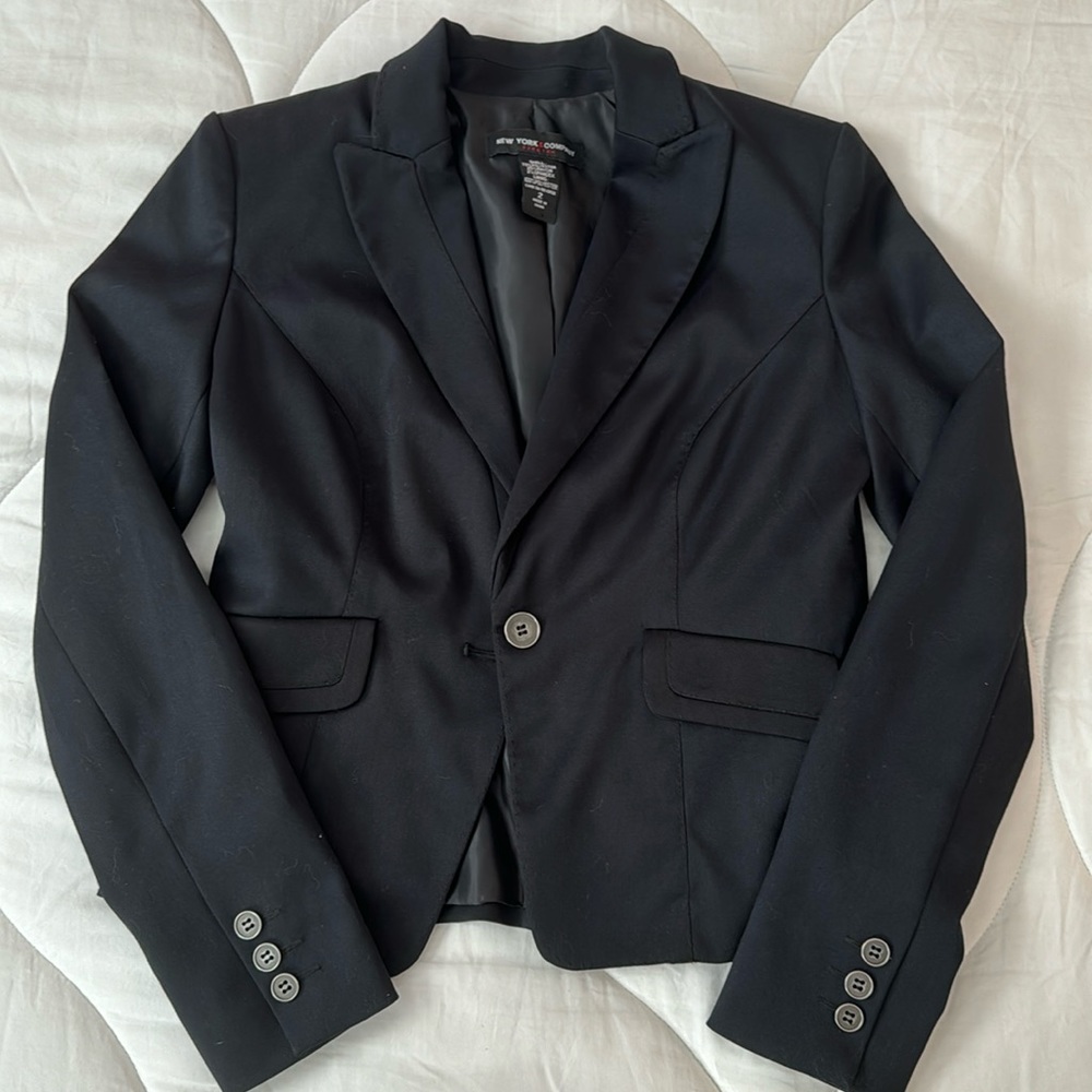 Lightly worn New York & Company black blazer, size 2